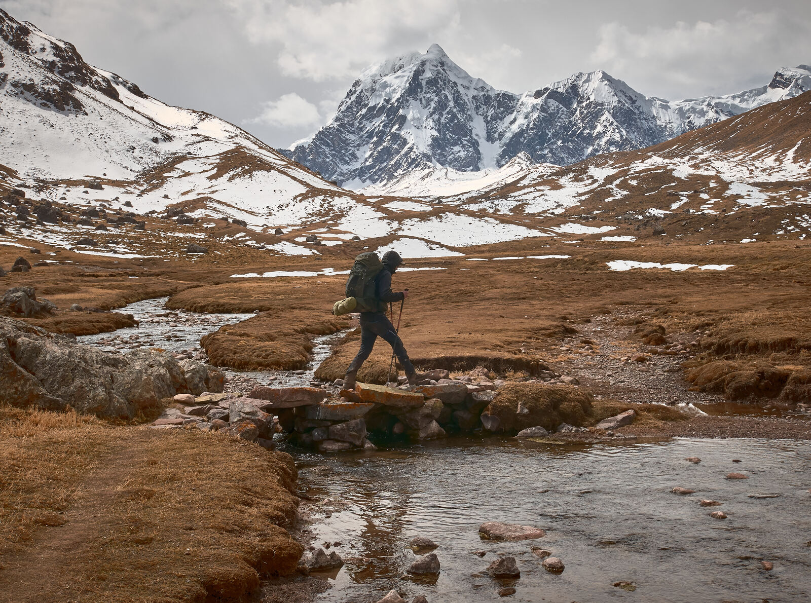 young hiker trekking tour through beautiful andes mountains peru